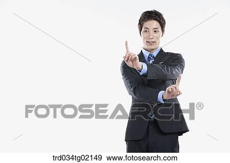 Stock Photo - A man touching something with his finger. Fotosearch