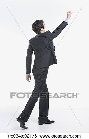 A man trying to catch something View Large Photo Image Stock Photograph - A man trying to catch something. Fotosearch