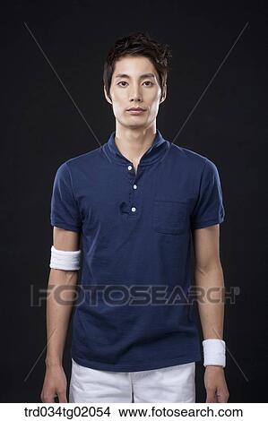 A man wearing the tennis sport wear View Large Photo Image Picture - A man wearing the tennis sport wear. Fotosearch