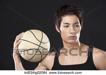 Picture - A man with a basketball. Fotosearch