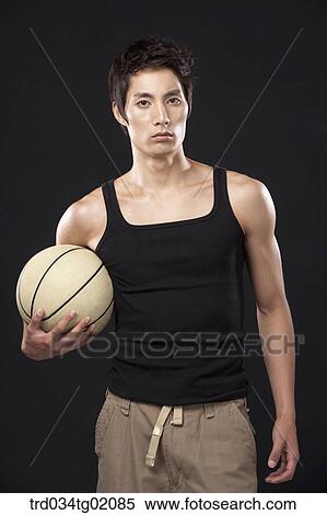 A man with a basketball View Large Photo Image Stock Photography - A man with a basketball. Fotosearch