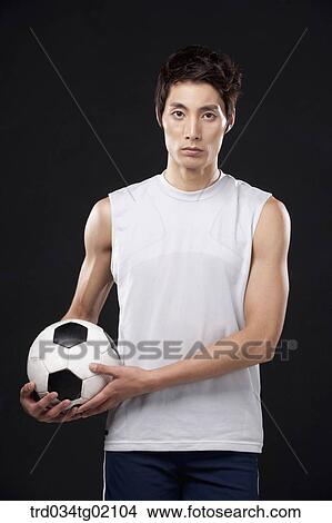 Picture - A man with a soccer ball. Fotosearch