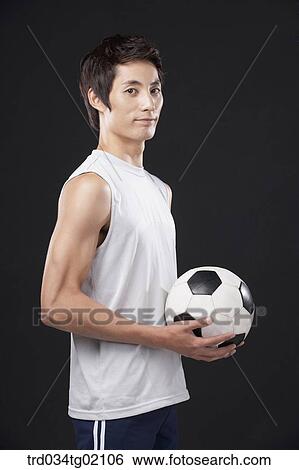 A man with a soccer ball View Large Photo Image Stock Photograph - A man with a soccer ball. Fotosearch