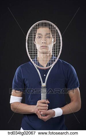 A man with a tennis racket View Large Photo Image Stock Photo - A man with a tennis racket. Fotosearch