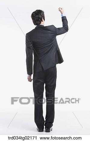 Stock Image - A man with his fist up . Fotosearch