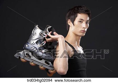 Picture - A man with in-line skate. Fotosearch