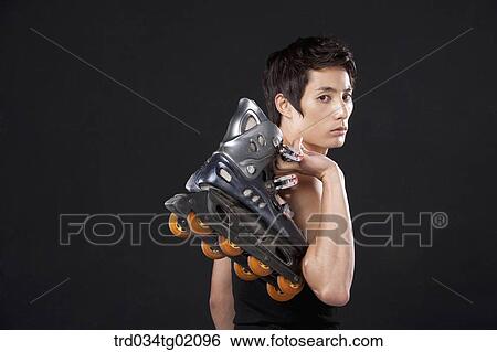 Stock Photograph - A man with in-line skate. Fotosearch