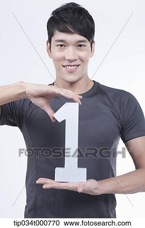 A man with the number one between his hands View Large Photo Image Stock Image - A man with the number one between his hands. Fotosearch