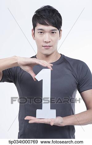 A man with the number one between his hands View Large Photo Image Stock Photo - A man with the number one between his hands. Fotosearch