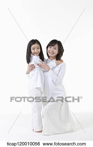 A mother and daughter hugging together View Large Photo Image Stock Photograph - A mother and daughter hugging together. Fotosearch