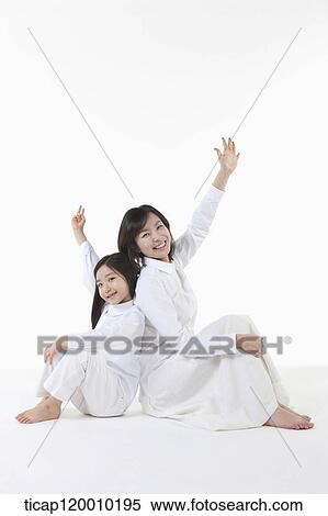 Stock Photography - A mother and daughter playing a game. Fotosearch