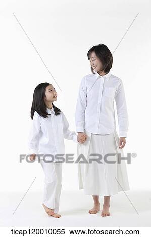 A mother and daughter smiling at each other View Large Photo Image Stock Photography - A mother and daughter smiling at each other. Fotosearch