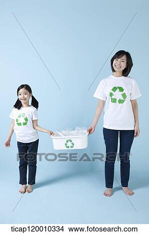 Picture - A mother and daughter with recycling bin . Fotosearch