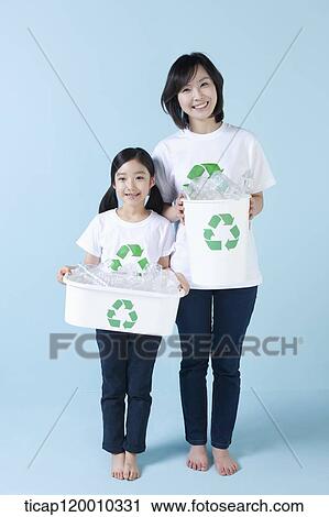 A mother and daughter with recycling bin View Large Photo Image Stock Image - A mother and daughter with recycling bin . Fotosearch