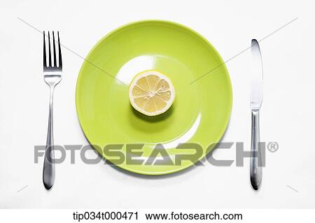 A piece of lemon on the dish View Large Photo Image Stock Image - A piece of lemon on the dish . Fotosearch