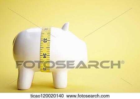 A piggy bank with tape measure View Large Photo Image Stock Image - A piggy bank with tape measure. Fotosearch