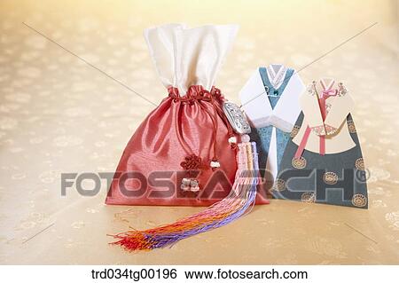 A red lucky bag and pieces of Korean traditional clothes View Large Photo Image Stock Photograph - A red lucky bag and pieces of Korean traditional clothes. Fotosearch