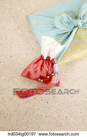 A red lucky bag with blue wrapped package in cloth View Large Photo Image Stock Photo - A red lucky bag with blue wrapped package in cloth . Fotosearch