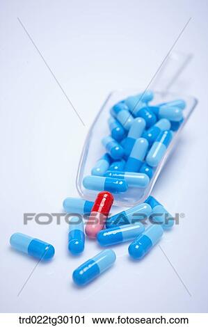 A red tablet with other blue tablets and dustpan around View Large Photo Image Stock Image - A red tablet with other blue tablets and dustpan around. Fotosearch