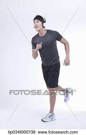 A running man listening to the music View Large Photo Image Stock Photo - A running man listening to the music. Fotosearch
