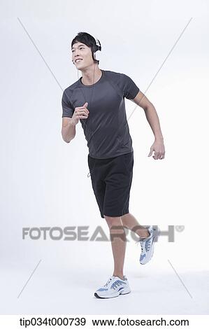 A running man listening to the music View Large Photo Image Stock Photo - A running man listening to the music. Fotosearch