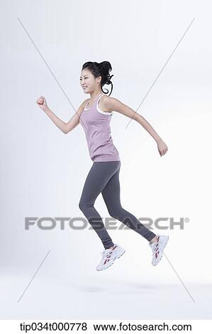 Stock Photo - A running woman. Fotosearch