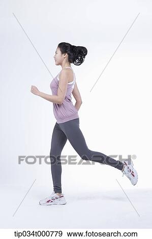 Stock Photo - A running woman. Fotosearch