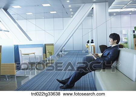 A smiling businessman with the tablet PC View Large Photo Image Stock Photo - A smiling businessman with the tablet PC. Fotosearch
