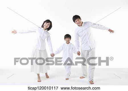 Stock Photo - A smiling family with their arms open . Fotosearch