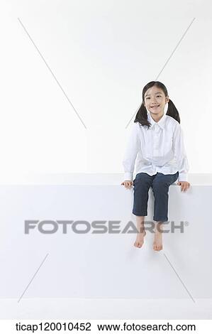 Stock Image - A smiling girl . Fotosearch