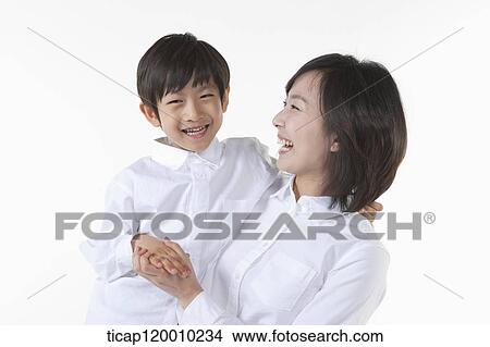 A smiling mother and son View Large Photo Image Picture - A smiling mother and son . Fotosearch