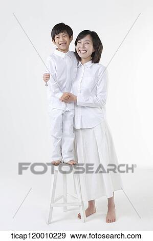 A smiling mother and son View Large Photo Image Stock Photo - A smiling mother and son . Fotosearch