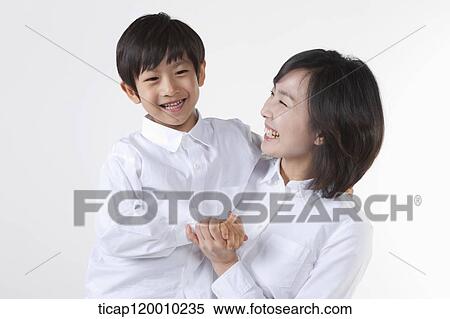 A smiling mother and son View Large Photo Image Stock Photography - A smiling mother and son . Fotosearch
