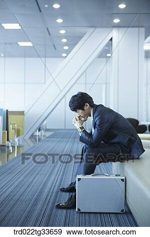 A stressful businessman with a briefcase View Large Photo Image Stock Photo - A stressful businessman with a briefcase. Fotosearch