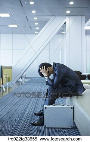 A stressful businessman with a briefcase View Large Photo Image Stock Photography - A stressful businessman with a briefcase. Fotosearch