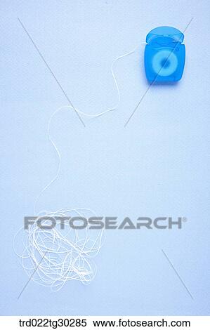 A tangled blue dental floss View Large Photo Image Stock Photography - A tangled blue dental floss. Fotosearch