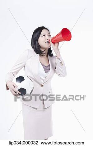A woman cheering with soccer ball and loud speaker View Large Photo Image Stock Image - A woman cheering with soccer ball and loud speaker. Fotosearch