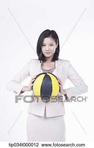 A woman holding the basketball View Large Photo Image Stock Image - A woman holding the basketball. Fotosearch