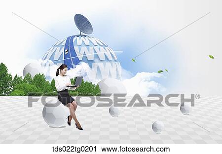 A woman looking at laptop with internet environment around View Large Photo Image Stock Image - A woman looking at laptop with internet environment around. Fotosearch