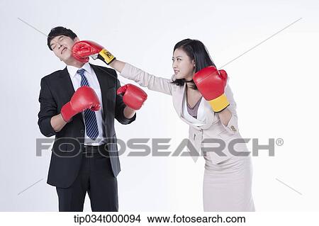Picture - A woman punching on a man . Fotosearch