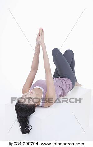 A woman stretching her body View Large Photo Image Picture - A woman stretching her body. Fotosearch