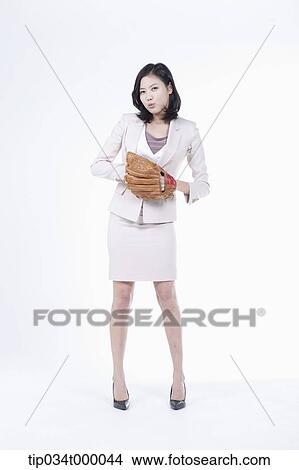 Picture - A woman wearing a baseball glove. Fotosearch