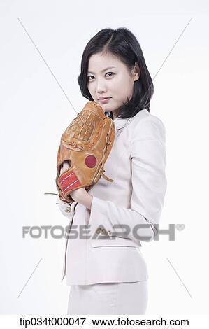 A woman wearing a baseball glove View Large Photo Image Stock Photo - A woman wearing a baseball glove. Fotosearch