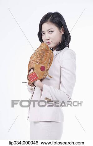 A woman wearing a baseball glove View Large Photo Image Stock Photograph - A woman wearing a baseball glove. Fotosearch