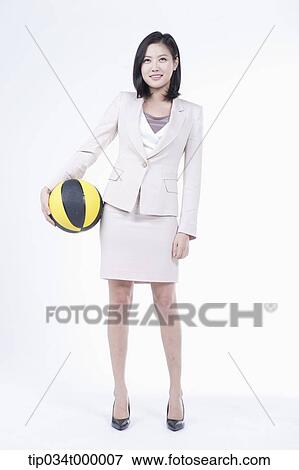Stock Photo - A woman with basketball. Fotosearch