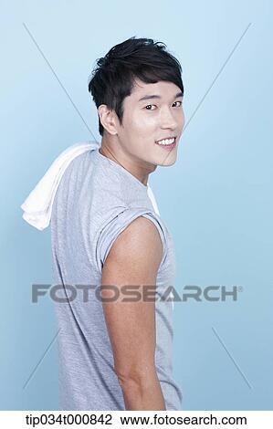 Stock Image - An exercising man with a towel. Fotosearch