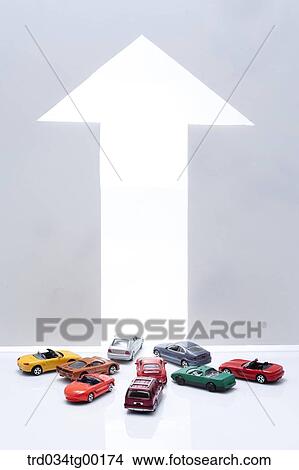 arrow sign and miniature cars View Large Photo Image Picture - arrow sign and miniature cars. Fotosearch