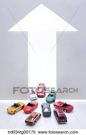 Stock Photography - arrow sign and miniature cars. Fotosearch
