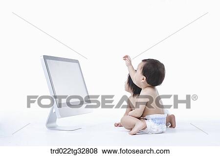 Babies around the monitor View Large Photo Image Stock Photo - Babies around the monitor. Fotosearch