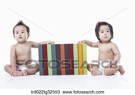 Babies sitting around the books View Large Photo Image Stock Image - Babies sitting around the books. Fotosearch